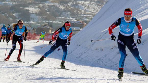 Katherine Ogden (left) skis to a 6th place finish in the 5/5K skiathalon at the 2015 Nordic Junior World Championships.