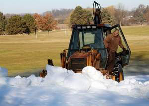 Plow snow onto cross country ski trails at Huron Meadows Metropark