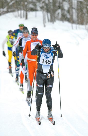 Ken Dawson leads a pack of skiers at the midpoint of the 51-kilometer Classic race during the Noquemanon Ski Marathon 
