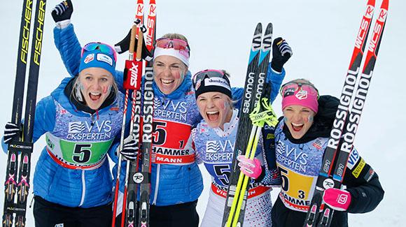 Sadie Bjornsen, Rosie Brennan, Jessie Diggins and Liz Stephen celebrate in the finish after taking third in Lillehammer. (Getty Images/AFP-Cornelius Poppe)