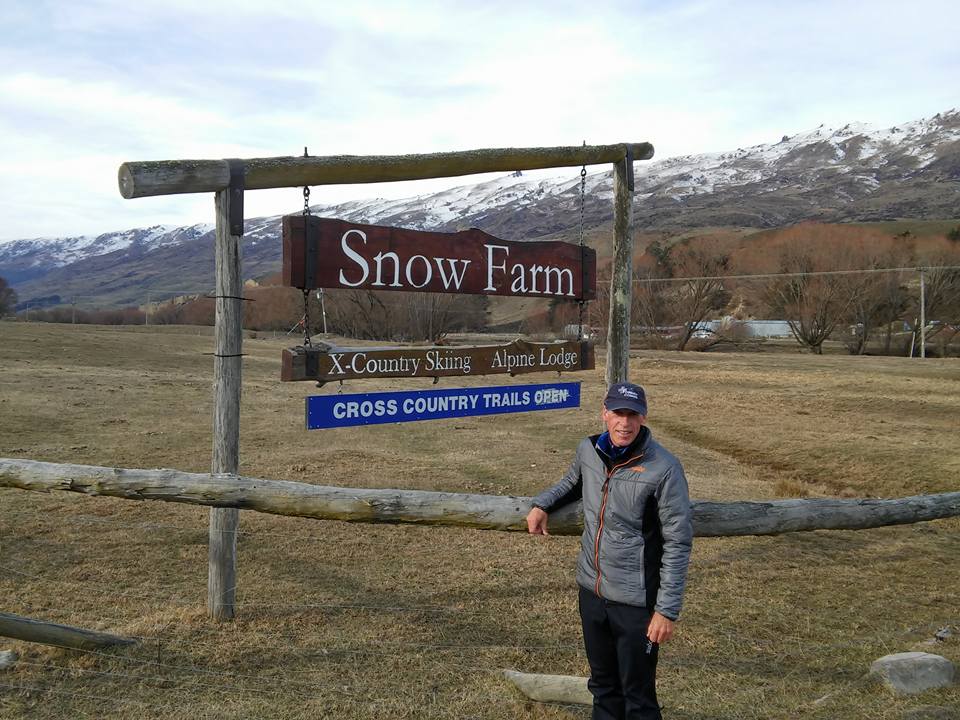 Michael Bourassa in front of the Snow Farm sign