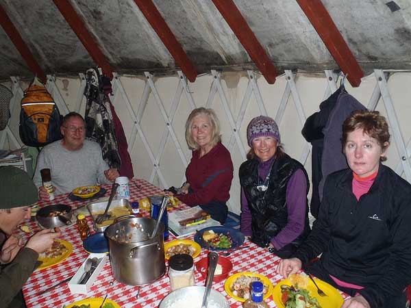 1-23 Yellowstone 138 dinner at Canyon Skier's Yurt Camp, guide Tom, Dave & Moe, Sara & Charlotte
