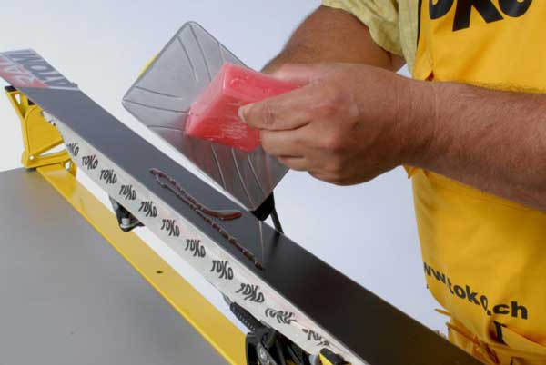 Iron wax on your skis before you store them for the summer