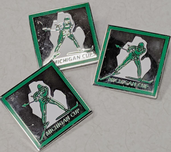 Michigan Cup pins for the top 10 percent fastest cross country skiers in each age group