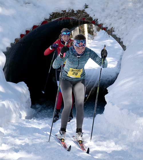 Skiers emerge from the Tunnel