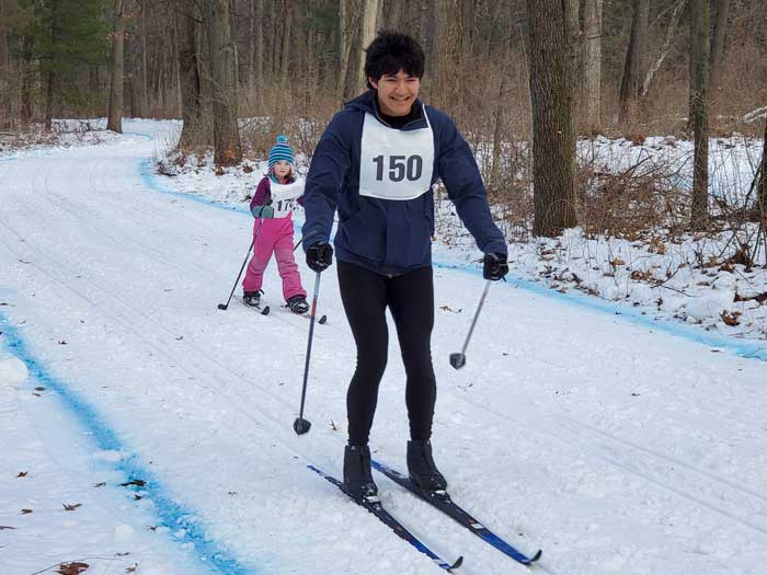 Krazy Klassic cross country ski racers on the course - 12k'er Joseph Brebeck laps 5k'er Avery Newmister