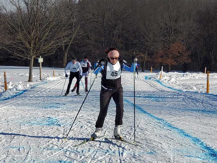 Linda Weeks-Kaleita (45) heading toward the end of a lap with a couple finishers in Saturday's Frosty Freestyle just behind her (35 - Jared Roberts and 42 - Bob Triebold. Photo - Mike Muha). Skate conditions were excellent!