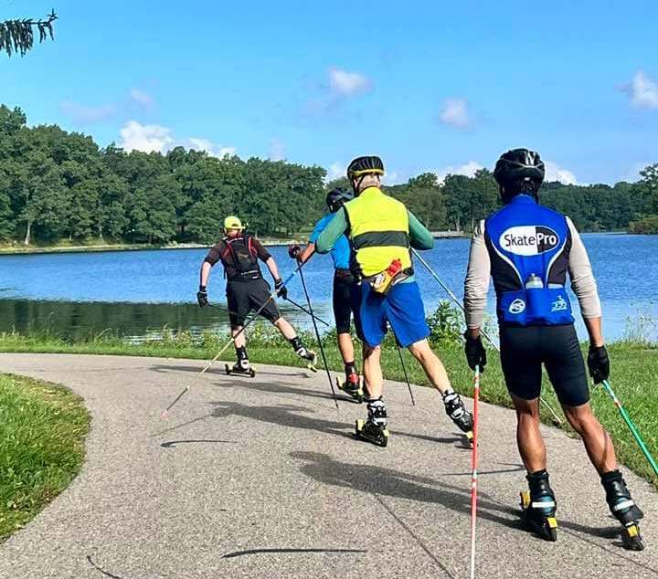 Team NordicSkiRacer members are moving to specific training as we head toward the new racing season! Yvon Dufour leads Sean Newmister, Doug Heady, and Kevin Vasquez around the Kensington Metropark bike path in Milford, Michigan. Photo by Ricardo Lung - also on rollerski!
