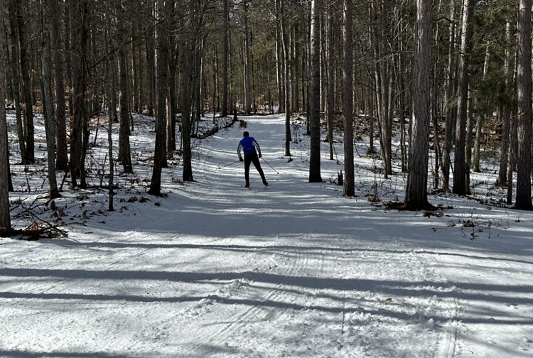 From John Gravlin: 'Here is a photo of the PI side of Black Mountain trails today. A fabulous fun ski…but there are a few bare spots starting to form.  We are very concerned about the yo-yo temperature predictions and the need for new snow. The race directors will look to make a cancellation decision by next Wednesday evening.  Our current plan is to offer a 12 km freestyle race, if possible, on Saturday March 2nd.   Stay tuned!!'
