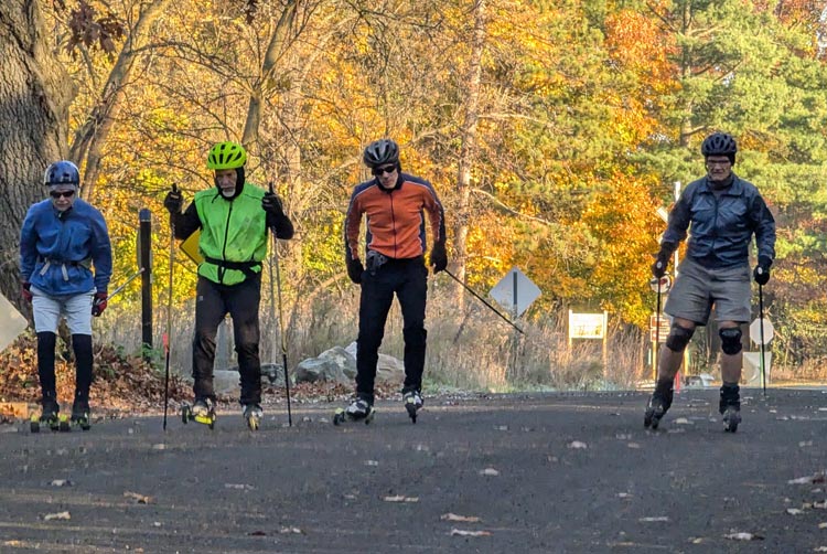 Team NordicSkiRacer's Zibgy Zlobicki, Tony Percha, Doug Cornell, and Cyril Grum at Island Lake Recreation Area, testing the new pavement. Conclusion? The section to Kent Lake is a 5; the rest of the repaving is only a 3. 