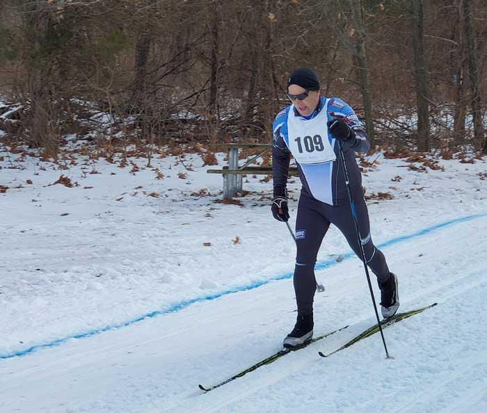 Krazy Klassic  cross country ski racers on the course - Adam Haberkorn races toward the finish