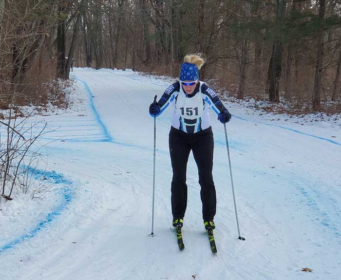 Krazy Klassic  cross country ski racers on the course - Jenna Briggs rounds the final corner