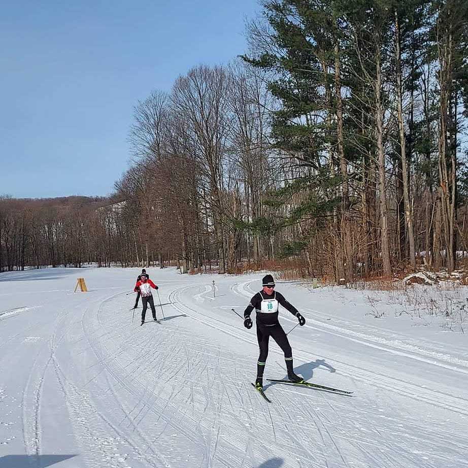 cross country skiers racing in the 2022 White Pine Stampede cross country ski race