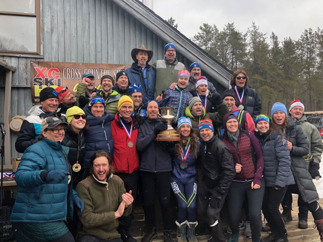 XCHQ team holding up the Michigan Cup