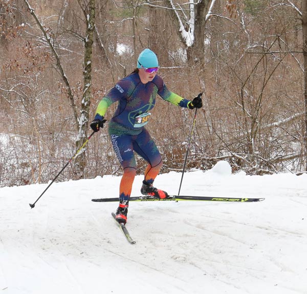 Rebecca Davis herringbones up the one steep hill on the course