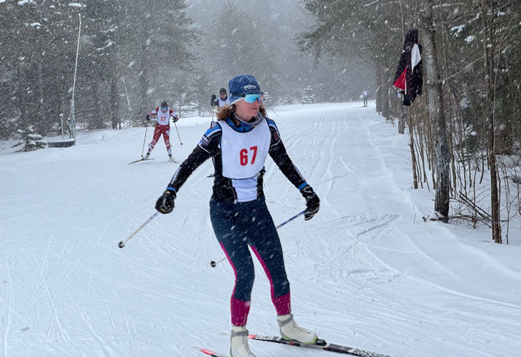 Sarah Newmister skiing to the finish line