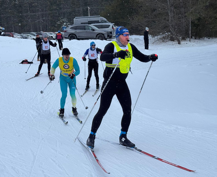 Jesse Crandall leads blind skier John Kusku to a joint 3rd and 4th place in the 40-49 age category